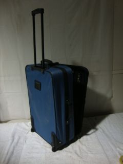 Leisure 4 Compartment Roll Around Luggage Suitcase EUC
