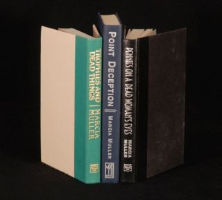 Three first edition copies of mysteries by Marcia Muller