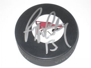 you are bidding on an original hand signed hockey puck that is