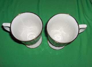 Up for sale are 2 beautiful footed, fluted mugs (5 5/8”) by Royal