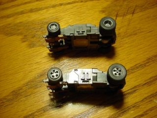 slot car narrow Indy type chassis .. slight wear .. rare hubs/wheels