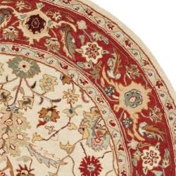 Hand hooked Tabriz Ivory/ Red Wool Rug (56 Round)